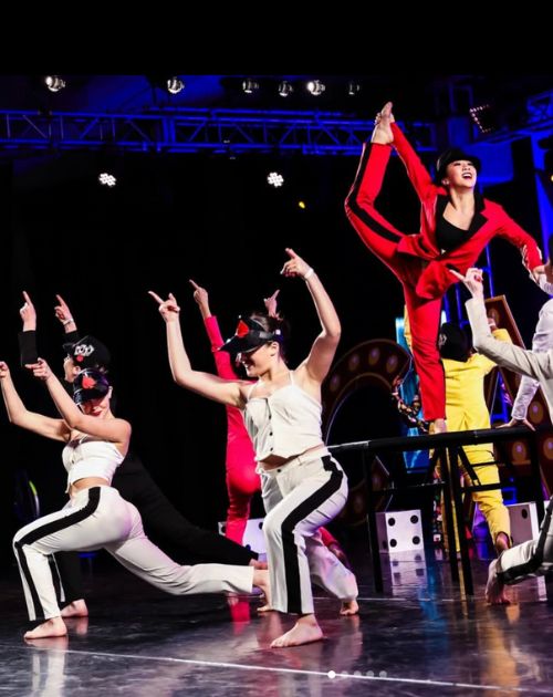 Dancers with innovative choreography spin on tables